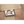 Load image into Gallery viewer, close up of logo of beige military bag logo
