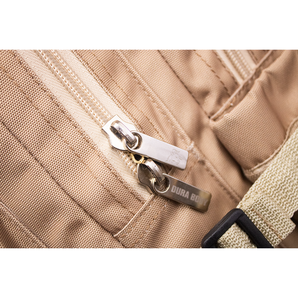 close up of zippers of the beige military bag