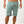 Load image into Gallery viewer, front of Athletic Light Olive Shorts with logo on the bottom left of the short
