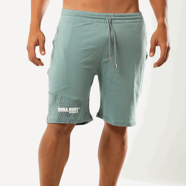 front of Athletic Light Olive Shorts with logo on the bottom left of the short