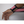 Load image into Gallery viewer, puting on a a pair of Pink wrist wrap 
