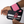 Load image into Gallery viewer, close up a of a pink wrist wrap while someone is puting it on
