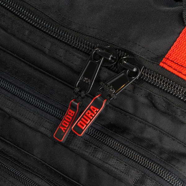 zippers of the black and red military bag